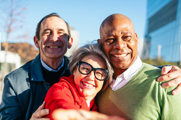 Three mature friends enjoying a sunny day together