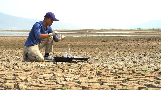 asian scientist analyzing an water and soil to find solutions of soil deterioration problems.