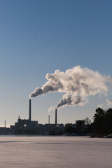 Power plant with smoking chimneys