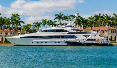 Luxury boat motor yacht in marina. Luxury yacht. Boating and yachting tourism. Luxurious life. Vacation on summer. Docked yacht at private area. Boat trip. Sea vacation on summer