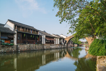 Fototapeta premium Old houses, rivers, and bridges in Zhouzhuang Ancient Town, Suzhou City, Jiangsu Province, China On April 18th, 2023