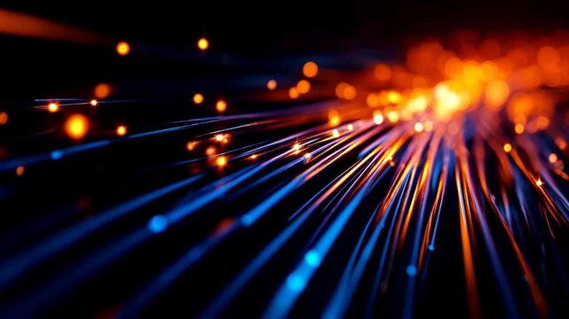Movement of an electronic pulse in the form of golden sparkles in a bundle of fiber optic cables, symbolizing the transmission of data.