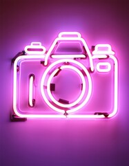 Neon camera sign in vibrant pink with DSLR outline and glowing aperture