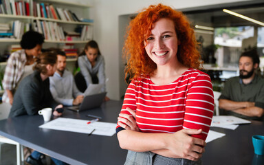 Portrait of young happy success woman working in a busy modern workplace, Startup coworker concept