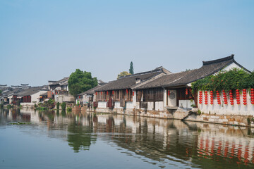 Fototapeta premium Old houses, rivers, and bridges in Zhouzhuang Ancient Town, Suzhou City, Jiangsu Province, China On April 18th, 2023