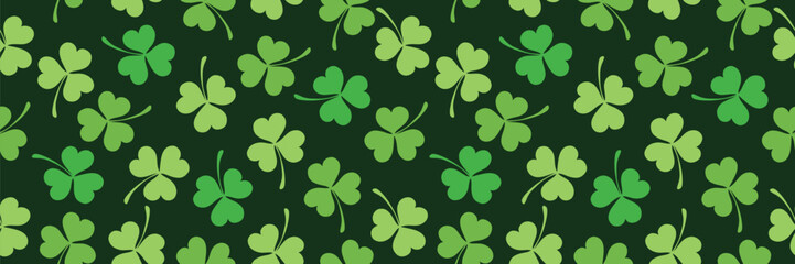 Seamless pattern of clover leaves for St. Patrick's Day. Clover leaves on green background. Suitable for wrapping paper, wallpaper, background, card and decoration. Simple stylized plant elements