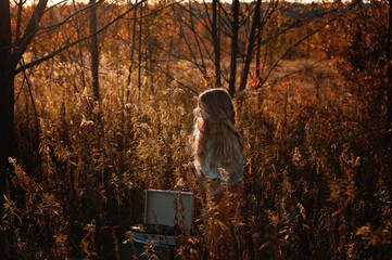 Profile young tween girl listening to record player outdoors