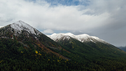 Snow-capped mountains of Oka District, showcasing the pristine and majestic beauty of the winter landscape from an aerial drone perspective