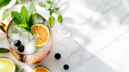 Selbstklebende Fototapeten National Moscow Mule Day Fresh mint and citrus moscow mule cocktail with ice and berries © Soba