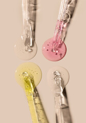 samples serum tests glass pipettes with drops of serum on a light beige background