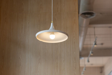 A white light fixture hanging from the ceiling