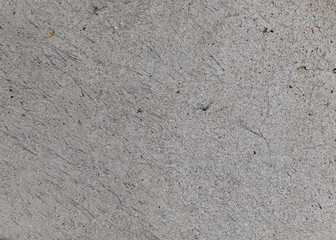 Textures of old concrete. Gray damaged concrete background, aged wall. Top view, close-up.