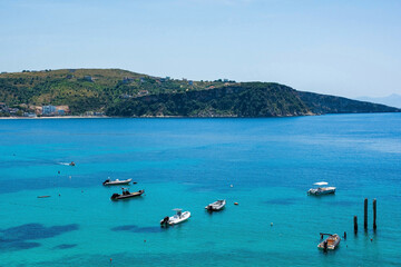 Boats in Himare Bay on the coast of southern Albania, part of the Albanian Riviera. Located in Vlore County, it lies between the Ceraunian Mountains and the Ionian Sea and is a major tourism centre