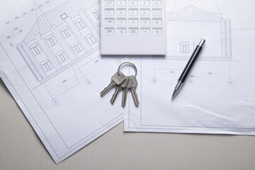 House keys on architectural project plan.