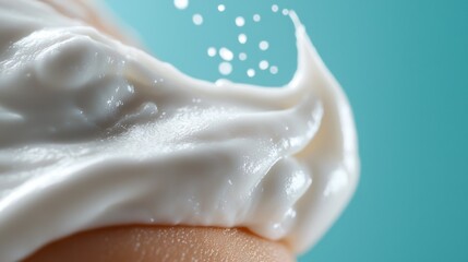 Obraz premium Close-up of sunscreen texture being meticulously applied to smooth, glowing skin for optimal sun protection and during the summer season.