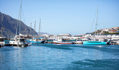Obraz premium South Africa, Hout bay harbor, boats moored at the marina. blue sky, sunny day