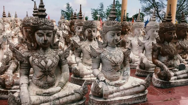 A playground with a lot of small Buddhist statues