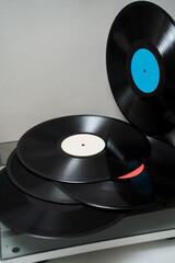 Closeup of modern turntable player and vinyl records. Vintage vinyl cartridges with Hi-Fi sound.