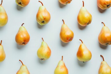 Fresh, ripe pears arranged neatly on a light background for a vibrant and colorful display