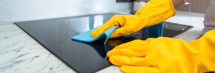 A Housewife Cleaning the Stove: A Reflection of Cleanliness and Care