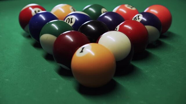 Pool balls being broken by cue ball close up stock footage
