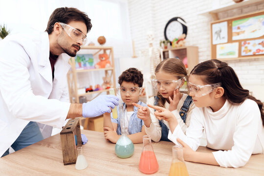 Children together with the teacher for chemistry lessons.