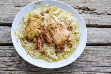 Home Oven Baked Chicken and Rice on rustic background