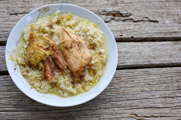 Home Oven Baked Chicken and Rice on rustic background