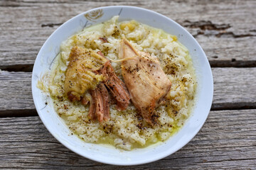Home Oven Baked Chicken and Rice on rustic background