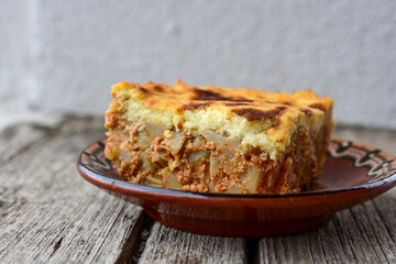 Potato and minced meat  Casserole  with   parmesan cheese and garlic on wooden rustic bakcground.  Bulgarian moussaka