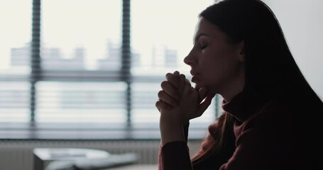 Young woman feels concerned due to bad life situation, debt or divorce. Lost in sad thoughts thinking of life or relationships problems.