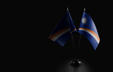 Small national flags of the Marshall on a black background