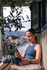 Fototapeta premium Work Remotely, Digital Nomad.digital nomad enjoys peaceful remote work setup balcony with a scenic mountain view essence of flexibility, work-life balance, and the freedom of location-independent work