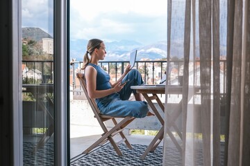 Work Remotely, Digital Nomad.digital nomad enjoys peaceful remote work setup balcony with a scenic mountain view essence of flexibility, work-life balance, and the freedom of location-independent work