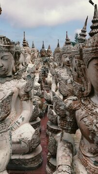Camera flight over a site with a large number of small Buddhist statues