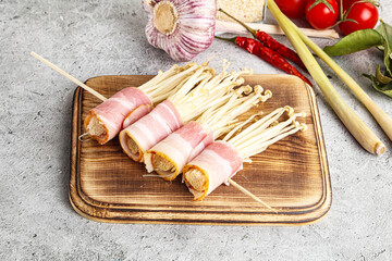 Raw Enoki mushroom with bacon