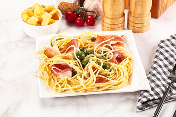 Pasta spaghetti with olives and jamon