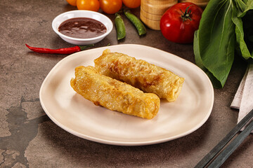 Vietnamese stuffed spring roll served sauce