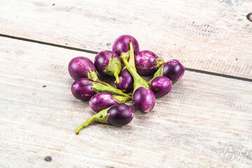 Small organic young purple round eggplant
