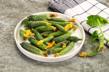 Raw gherkin cucumbers in the bowl