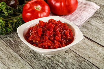 Diced ripe tomato with sauce