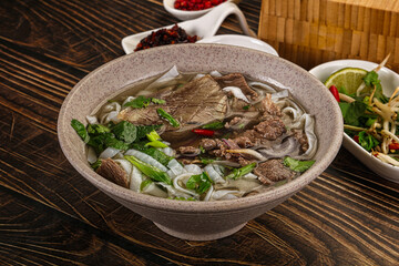 Vietnamese Pho Bo soup with beef and noodles