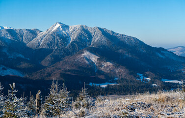 A view of the upper levels of the mountains covered in frost on a beautiful frosty day.