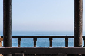seascape through the gazebo interior on the seaside hill