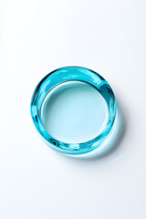 Clear blue cosmetic gel serum oil drop isolated on white background. Hyaluronic acid skincare product top view