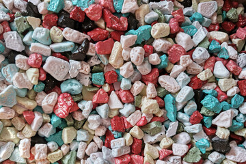 Bunch of sweets dragees with multicolored glaze closeup. Candy background