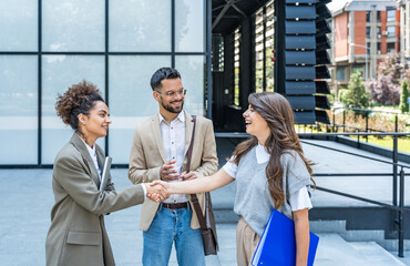 Professional occupation, office workers. Business people meet before staff meeting and presentation...
