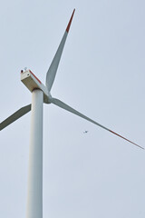 wind power generator and the plane on background