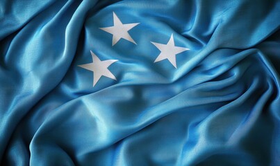 Blue fabric with three white stars, symbolizing unity and peace, draped elegantly