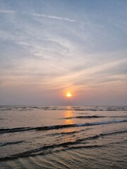 Arambol beach at sunset. View of the ocean and sky. Sea at evening sunset. India. Goa. High quality photo